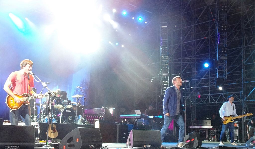 A photo of the English rock band Blur playing on stage